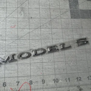 NEW GENUINE TESLA MODEL S BADGE / EMBLEM 1013738-00-C